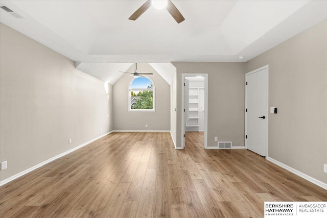 16324 Chicago St, Omaha, NE 68118 - unfurnished bedroom featuring light wood-type flooring, a walk in closet, baseboards, lofted ceiling, and a ceiling fan
