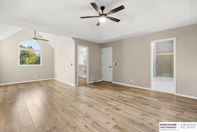 16324 Chicago St, Omaha, NE 68118 - unfurnished living room featuring a ceiling fan, light wood-type flooring, and vaulted ceiling
