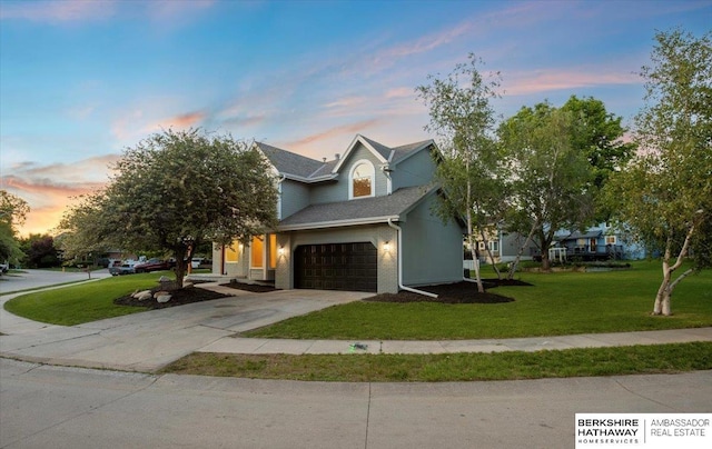 16324 Chicago St, Omaha, NE 68118 - view of front of property featuring a lawn, concrete driveway, and an attached garage