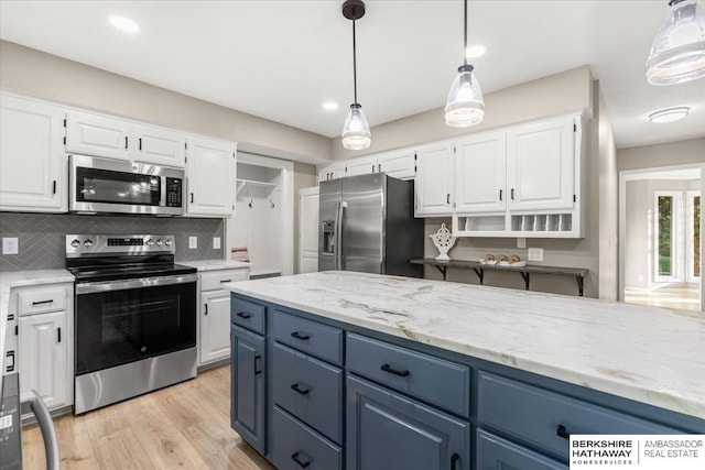 16324 Chicago St, Omaha, NE 68118 - kitchen featuring appliances with stainless steel finishes, blue cabinetry, white cabinetry, tasteful backsplash, and recessed lighting