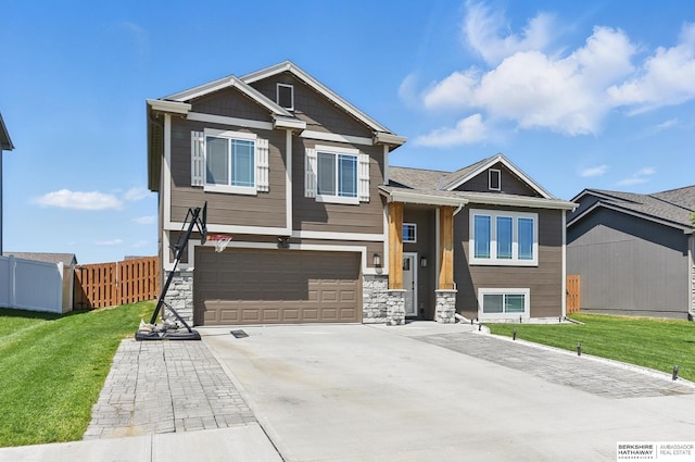 7164 N 167th St, Bennington, NE 68007 - craftsman-style home with a garage, driveway, and stone siding