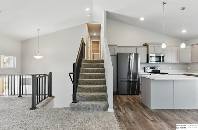 7164 N 167th St, Bennington, NE 68007 - kitchen featuring appliances with stainless steel finishes, lofted ceiling, gray cabinets, light countertops, and dark wood-style floors