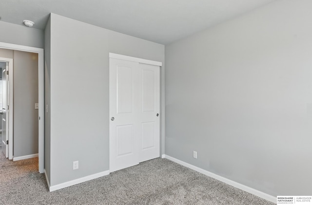 7164 N 167th St, Bennington, NE 68007 - unfurnished bedroom with carpet, baseboards, and a closet