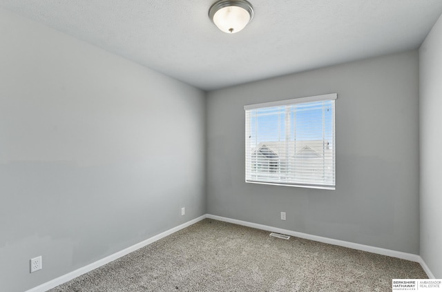 7164 N 167th St, Bennington, NE 68007 - carpeted spare room with baseboards
