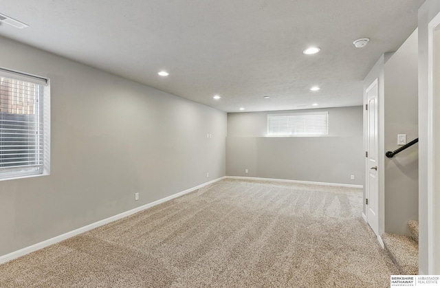 7164 N 167th St, Bennington, NE 68007 - basement with recessed lighting, carpet, and baseboards