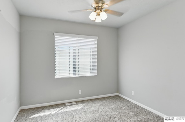 7164 N 167th St, Bennington, NE 68007 - carpeted empty room with a ceiling fan and baseboards