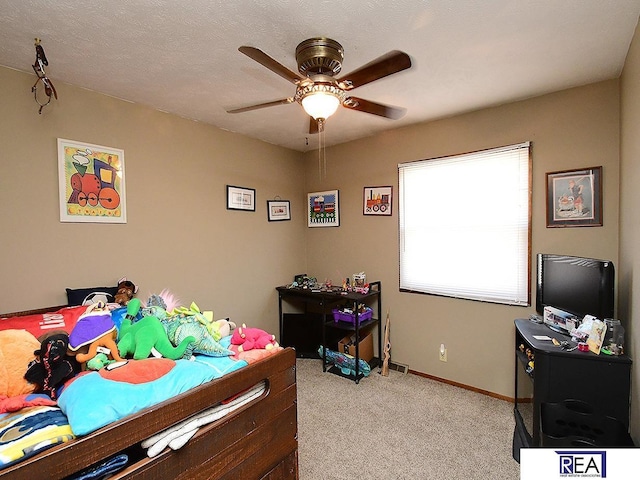 2103 Randall Dr, Bellevue, NE 68005 - carpeted bedroom with baseboards and a ceiling fan