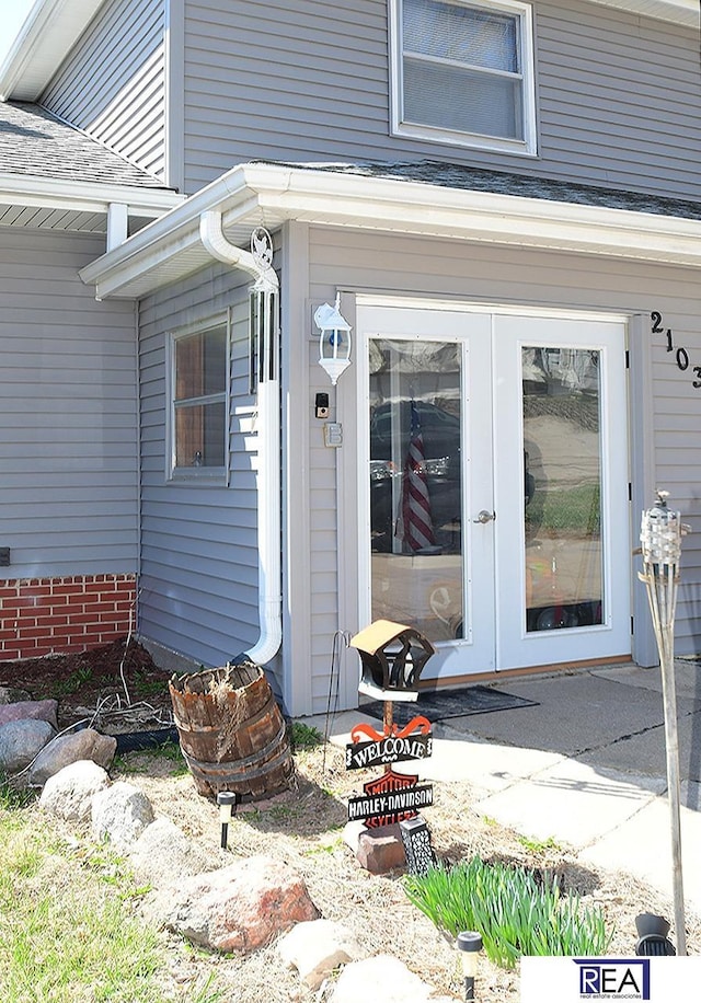 2103 Randall Dr, Bellevue, NE 68005 - entrance to property with french doors and a shingled roof