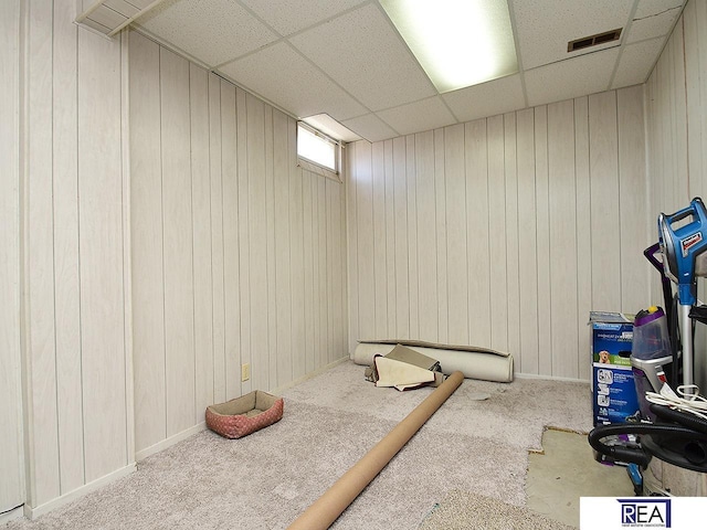 2103 Randall Dr, Bellevue, NE 68005 - workout room with a drop ceiling, carpet floors, and wooden walls