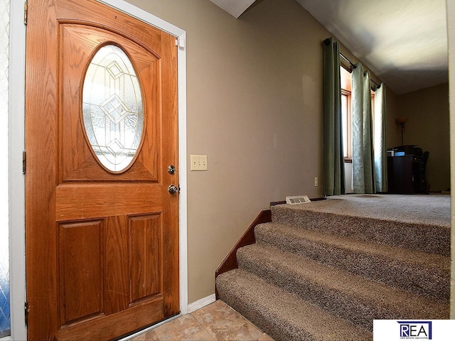 2103 Randall Dr, Bellevue, NE 68005 - foyer entrance with baseboards and light tile patterned floors