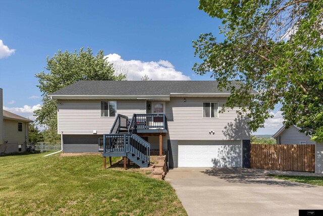 2706 Overlook Cir, Plattsmouth, NE 68048 - view of front facade featuring stairs, an attached garage, concrete driveway, and a deck