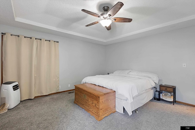 2706 Overlook Cir, Plattsmouth, NE 68048 - bedroom with a raised ceiling, carpet, baseboards, and a ceiling fan
