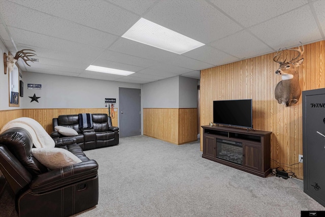2706 Overlook Cir, Plattsmouth, NE 68048 - carpeted living room featuring wooden walls, a wainscoted wall, and a drop ceiling