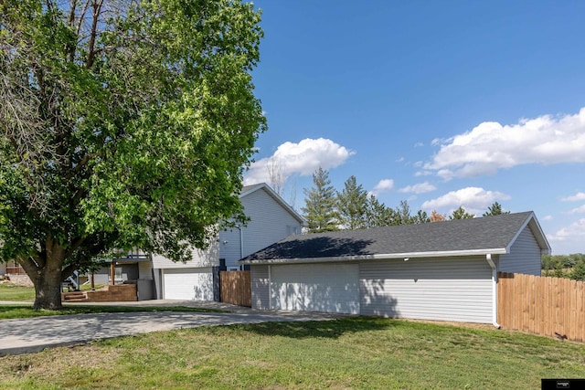 2706 Overlook Cir, Plattsmouth, NE 68048 - view of property exterior with driveway, an attached garage, and a shingled roof