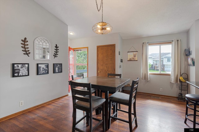 2706 Overlook Cir, Plattsmouth, NE 68048 - dining area with dark wood-type flooring and baseboards