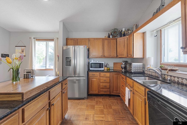 2706 Overlook Cir, Plattsmouth, NE 68048 - kitchen with stainless steel fridge with ice dispenser, dishwasher, a sink, white microwave, and dark stone countertops
