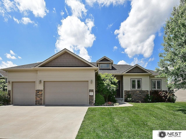 7521 Exbury Rd, Lincoln, NE 68516 - craftsman inspired home featuring stone siding, a front lawn, concrete driveway, and an attached garage
