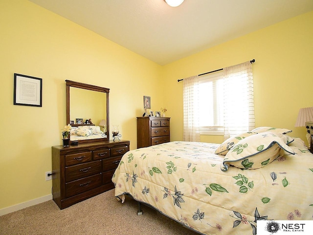 7521 Exbury Rd, Lincoln, NE 68516 - carpeted bedroom featuring baseboards and vaulted ceiling