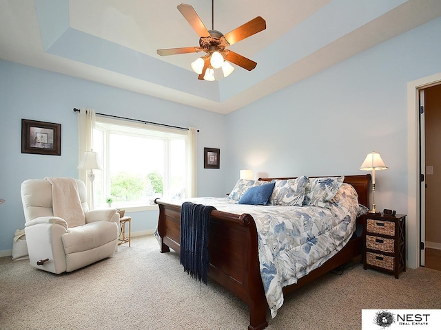 7521 Exbury Rd, Lincoln, NE 68516 - bedroom with carpet floors, baseboards, a raised ceiling, and ceiling fan