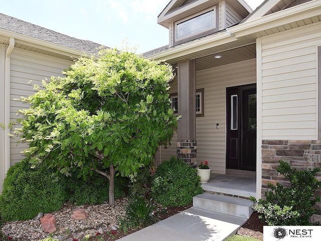 7521 Exbury Rd, Lincoln, NE 68516 - view of exterior entry with a porch
