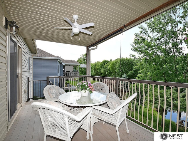 7521 Exbury Rd, Lincoln, NE 68516 - wooden terrace featuring a ceiling fan and outdoor dining space
