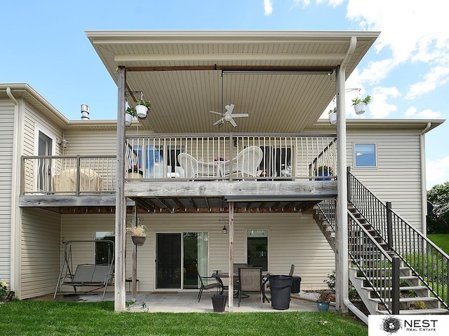 7521 Exbury Rd, Lincoln, NE 68516 - rear view of house with ceiling fan, a patio, and stairway