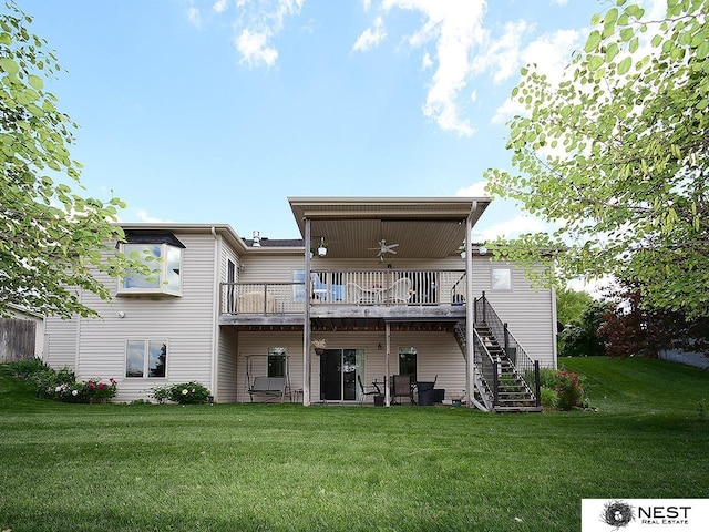 7521 Exbury Rd, Lincoln, NE 68516 - back of property featuring stairway, a lawn, and a wooden deck