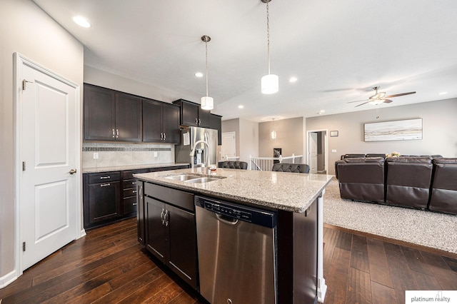 19349 I St, Omaha, NE 68135 - kitchen with stainless steel appliances, open floor plan, a sink, dark wood finished floors, and recessed lighting