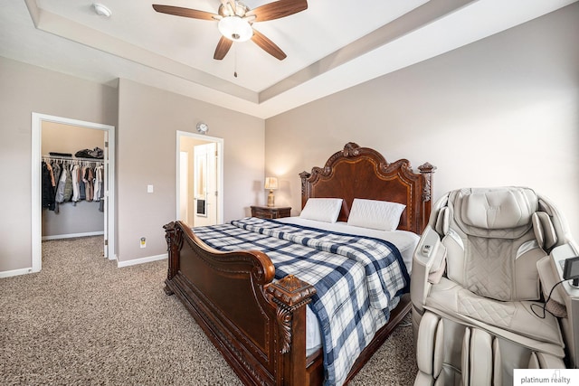 19349 I St, Omaha, NE 68135 - bedroom featuring carpet floors, a walk in closet, baseboards, a closet, and a tray ceiling