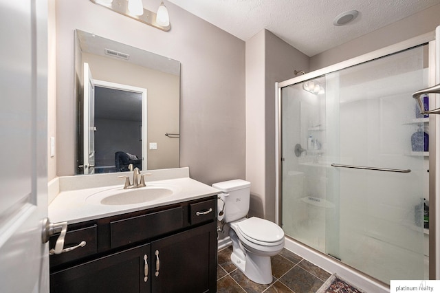 19349 I St, Omaha, NE 68135 - full bath featuring vanity, a stall shower, toilet, a textured ceiling, and ensuite bathroom
