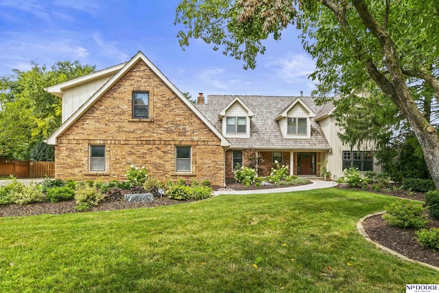 9826 Harney Pkwy N, Omaha, NE 68114 - view of front facade with brick siding, a chimney, and board and batten siding