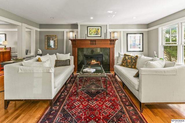 9826 Harney Pkwy N, Omaha, NE 68114 - living area featuring wood finished floors, a fireplace, and recessed lighting