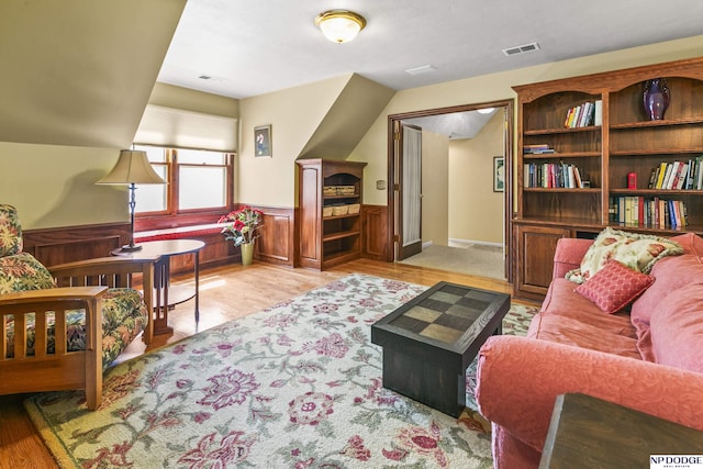 9826 Harney Pkwy N, Omaha, NE 68114 - living area featuring wood finished floors and a wainscoted wall