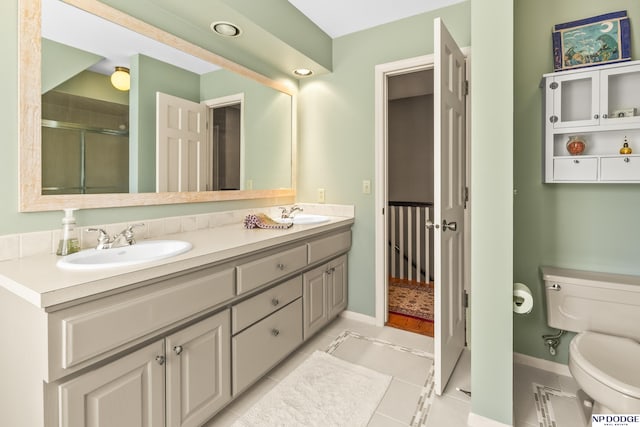 9826 Harney Pkwy N, Omaha, NE 68114 - full bathroom featuring double vanity, baseboards, toilet, a stall shower, and tile patterned floors