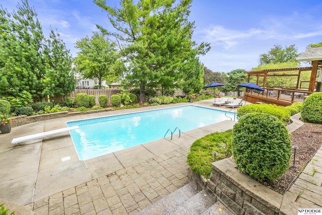 9826 Harney Pkwy N, Omaha, NE 68114 - view of pool featuring a diving board, a deck, and a patio