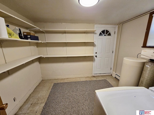 1241 Bessie St, Goehner, NE 68364 - storage area featuring a baseboard heating unit and washer / clothes dryer
