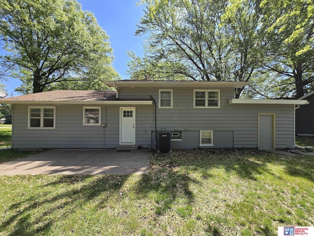 1241 Bessie St, Goehner, NE 68364 - rear view of house featuring a yard, central AC unit, and a patio area