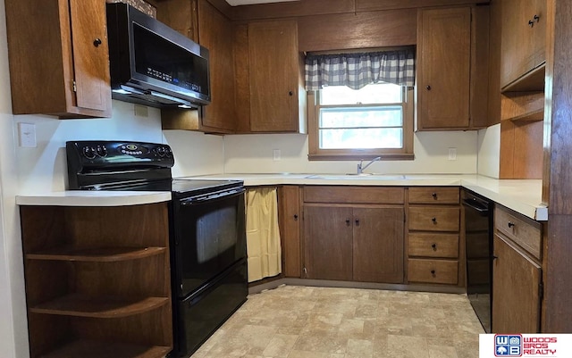 1241 Bessie St, Goehner, NE 68364 - kitchen with black appliances, open shelves, light countertops, and a sink