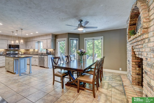 1014 Hickory Hill Rd, Papillion, NE 68046 - dining area featuring a ceiling fan, light tile patterned flooring, recessed lighting, a textured ceiling, and baseboards