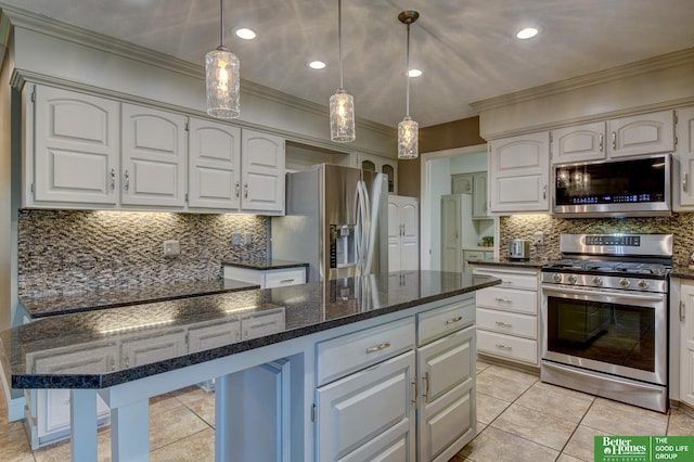 1014 Hickory Hill Rd, Papillion, NE 68046 - kitchen featuring appliances with stainless steel finishes, crown molding, decorative backsplash, decorative light fixtures, and dark stone countertops