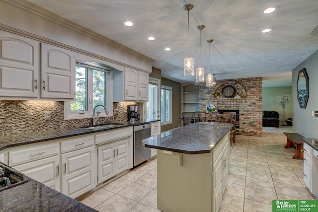 1014 Hickory Hill Rd, Papillion, NE 68046 - kitchen with dishwasher, a sink, recessed lighting, plenty of natural light, and open floor plan