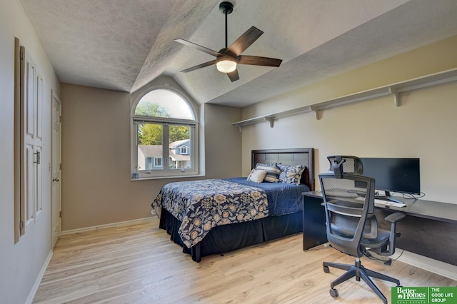 1014 Hickory Hill Rd, Papillion, NE 68046 - bedroom featuring lofted ceiling, a desk, wood finished floors, a textured ceiling, and baseboards