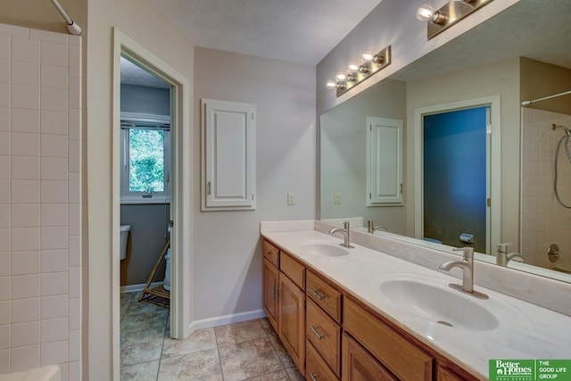 1014 Hickory Hill Rd, Papillion, NE 68046 - bathroom featuring double vanity, shower / bath combination, toilet, and baseboards