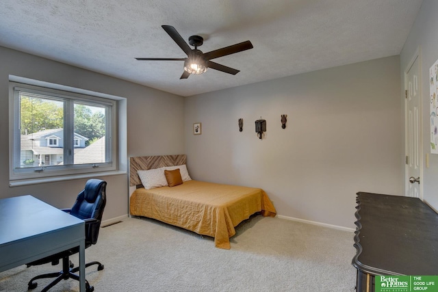 1014 Hickory Hill Rd, Papillion, NE 68046 - bedroom with carpet flooring, baseboards, an office area, ceiling fan, and a textured ceiling