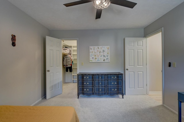 1014 Hickory Hill Rd, Papillion, NE 68046 - bedroom featuring carpet flooring, a walk in closet, baseboards, and a closet