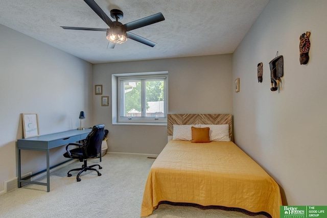 1014 Hickory Hill Rd, Papillion, NE 68046 - carpeted bedroom with a desk, ceiling fan, a textured ceiling, and baseboards