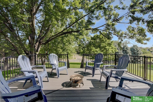 1014 Hickory Hill Rd, Papillion, NE 68046 - wooden deck featuring a fire pit and view of scattered trees