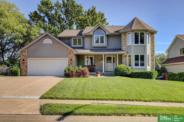 1014 Hickory Hill Rd, Papillion, NE 68046 - view of front of house featuring a porch, a garage, driveway, a front lawn, and a shingled roof