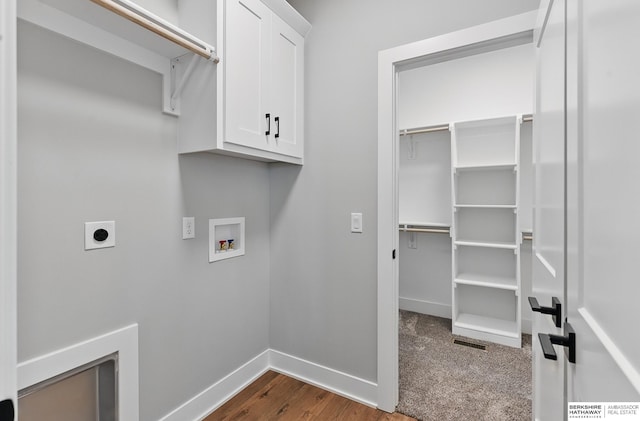 8218 N 167th Ave, Bennington, NE 68007 - laundry area with electric dryer hookup, baseboards, washer hookup, cabinet space, and dark wood-type flooring