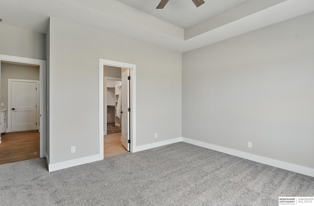 8218 N 167th Ave, Bennington, NE 68007 - unfurnished bedroom with carpet flooring, baseboards, a spacious closet, and a ceiling fan